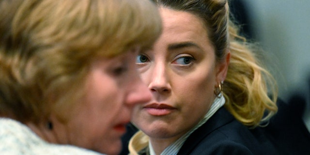 Attorney Elaine Bredehoft, left, and actress Amber Heard look on during a trial in the Fairfax County Circuit Courthouse in Fairfax, Virginia, on April 19, 2022. After Paradis and Depp split in 2012, the star started dating Heard. By Christmas Eve 2013, they were engaged, and in 2015, they were saying their "I Dos."