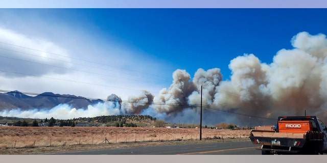 Smoke from the Tunnel Fire fills the sky in Doney Park, outside Flagstaff, Ariz., on Tuesday, April 19, 2022. (Cheryl L. Miller-Woody via AP)