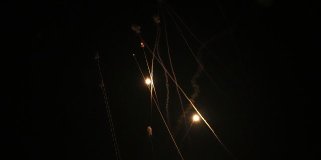 Israel's Iron Dome air defense system launches missiles to intercept rockets fired from the Gaza Strip toward Israel, over Gaza City, early Thursday, April 21, 2022.