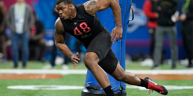 Georgia defensive lineman Travon Walker runs a drill during the NFL football scouting combine, Saturday, March 5, 2022, in Indianapolis. Walker is expected to be taken in the NFL Draft.