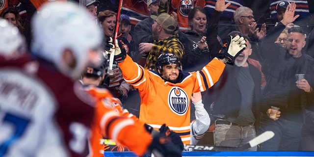 Edmonton Oilers' Evander Kane (91) celebrates a goal against the Colorado Avalanche during the second period of an NHL hockey game in Edmonton, Alberta, Friday, April 22, 2022. 
