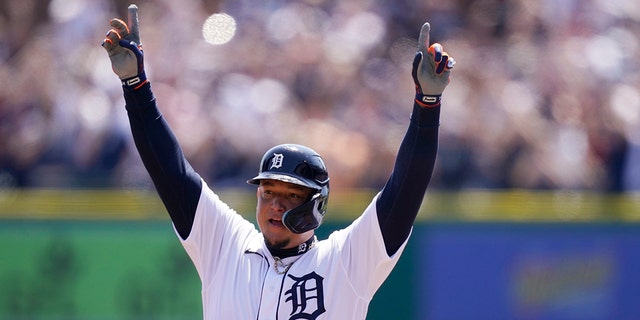 Detroit Tigers designated hitter Miguel Cabrera reacts on first base after his 3,000th career hit during the first inning of the first baseball game of a doubleheader against the Colorado Rockies, Saturday, April 23, 2022, in Detroit. 