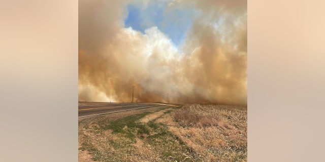 This image provided by the Nebraska State Patrol shows smoke from a wildfire, Saturday, April 23, 2022 near Cambridge, Neb. Several small towns, including Cambridge, Bartley, Indianola and Wilsonville, in Nebraska's southwest and Macy in its northeast, were forced to temporarily evacuate because of the wind-driven wildfires.