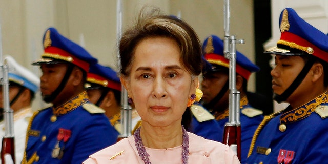 Aung San Suu Kyi reviewing an honor guard at the Peace Palace in Phnom Penh, Cambodia on April 30, 2019. 