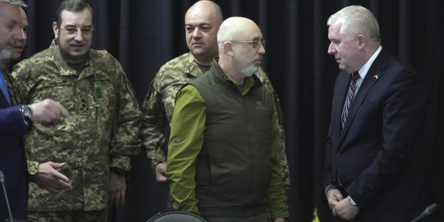 Ukraine Defense Minister Oleksii Reznikov, second right, speaks to his counterpart from Lithuania, Arvydas Anusauskas, at Ramstein Air Base in Germany, Tuesday, April 26, 2022.