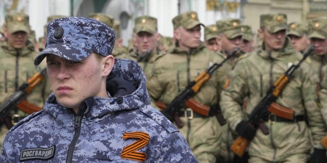 A soldier of the Russian Rosguard (National Guard) with a letter Z attached, which has become a symbol of the Russian army, stands guard during the rehearsal for the Victory Day military parade which will take place in Dvortsovaya Square (Palace) on the 9th. May to celebrate 77 years after the victory in World War II in St. Petersburg, Russia, on Tuesday, April 26, 2022. 