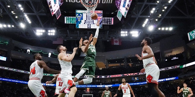 Milwaukee Bucks' Giannis Antetokounmpo shoots during the first half of Game 5 of an NBA basketball first-round playoff series Wednesday, April 27, 2022, in Milwaukee.
