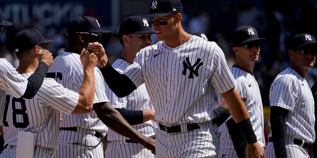 New York Yankees right fielder Aaron Judge takes the field with his teammates before the Yankees' opening day game against the Boston Red Sox, Friday, April 8, 2022, in New York.