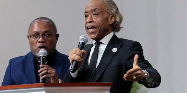 Rev. Al Sharpton, right, was adamant that Tawana Brawley "deserved to have her day in court," despite conclusions that he claims were a hoax, according to a grand jury.