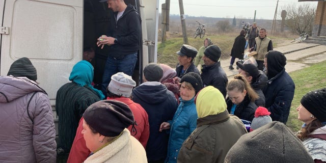 Andrew Moroz is a Ukrainian-born priest in Lynchburg, Virginia. He is seen here distributing aid in Ukraine in April 2022.