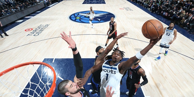 Antonio Edwards #1 of the Minnesota Timberwolves drives to the basket against the LA Clippers during the 2022 Play-In Tournament on April 12, 2022 at Target Center in Minneapolis, Minnesota. 