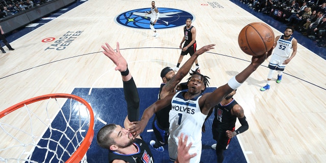Anthony Edwards #1 of the Minnesota Timberwolves drives to the basket against the LA Clippers during the 2022 Play-In Tournament on April 12, 2022 at Target Center in Minneapolis, Minnesota.