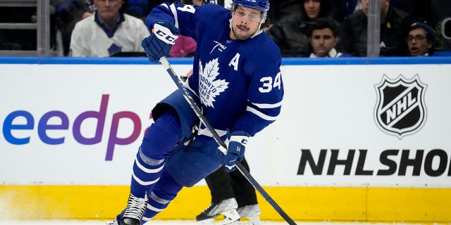 Toronto Maple Leafs center Auston Matthews (34) chases the puck during first-period NHL hockey game action against the Winnipeg Jets in Toronto, Thursday, March 31, 2022.