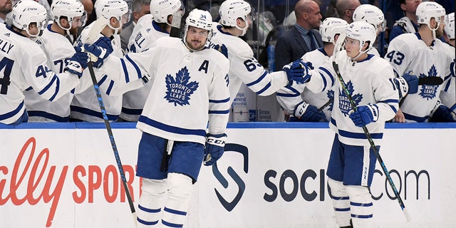 Toronto Maple Leafs center Auston Matthews (34) celebrates his second period goal during an NHL hockey game against the Tampa Bay Lightning, Monday, April 4, 2022, in Tampa, Fla.
