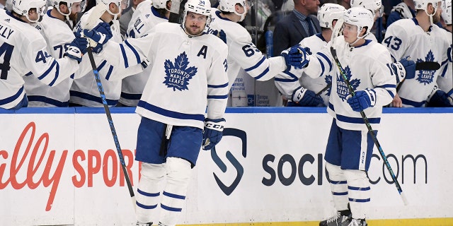 Toronto Maple Leafs center Auston Matthews (34) celebrates his second period goal during an NHL hockey game against the Tampa Bay Lightning, Monday, April 4, 2022, in Tampa, Fla.
