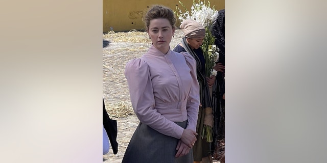 Amber Heard in costume on set of "In The Fire"
