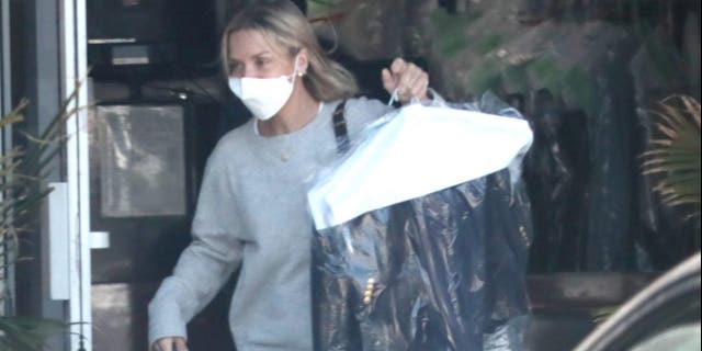 Hunter Biden's wife, Melissa Cohen, picks up dry cleaning on April 12, 2022, in Los Angeles.