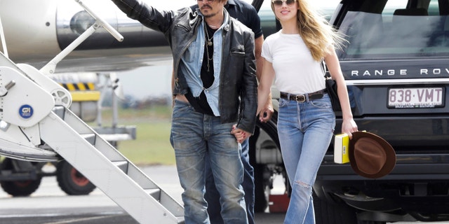 Johnny Depp and Amber Heard are pictured arriving in Australia in 2015 following the actor’s hand injury.