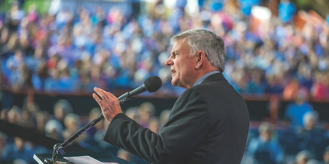 Rev. Franklin Graham delivers remarks at a faith-focused event. He has traveled twice to Ukraine amid the Ukraine-Russia war, as his organization helps Ukrainians who have lost everything. 