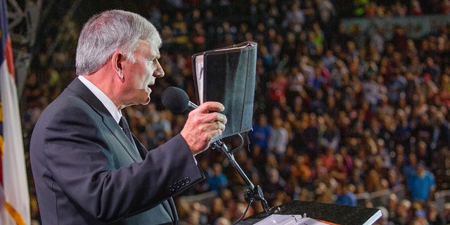 Rev. Franklin Graham is pictured preaching during a faith event. He said that the country "needs more leaders" like Florida Gov. Ron DeSantis, who has been willing to stand up against Disney's political stances. "God bless him and the Florida legislature," wrote Graham on his Facebook account.