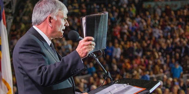 Rev. Franklin Graham is pictured preaching during a faith event. He said that the country "needs more leaders" like Florida Gov. Ron DeSantis, who has been willing to stand up against Disney's political stances. "God bless him and the Florida legislature," wrote Graham on his Facebook account.