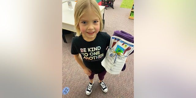 Students writing handwritten notes to people in need for Blankets of Hope. 