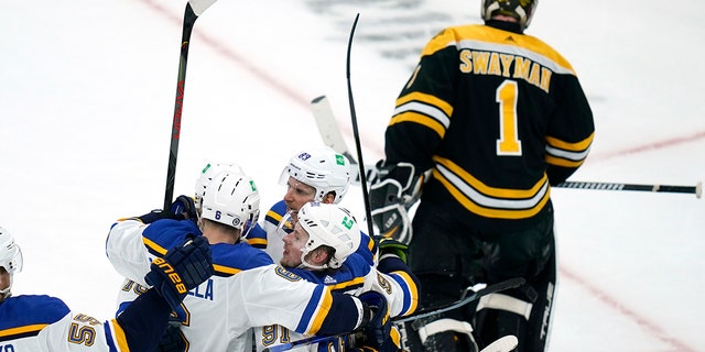 St. Louis Blues right wing Vladimir Tarasenko (91) is congratulated by teammates after his goal off Boston Bruins goaltender Jeremy Swayman (1) during the second period of an NHL hockey game, Tuesday, April 12, 2022, in Boston.