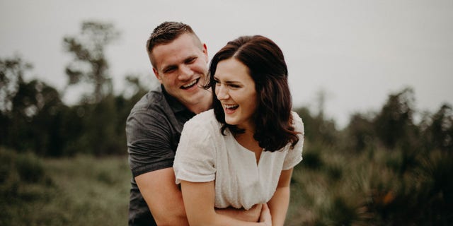 Jared and Kirsten Bridegan pose for an engagement photo.