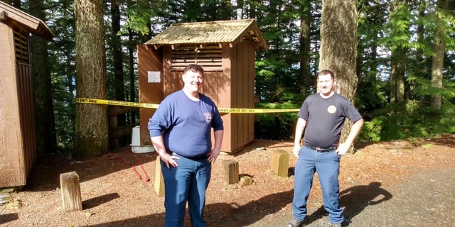 Firefighters Rubal and Torres, pictured above, helped rescue the woman after she fell into the vault toilet while trying to fish out her cellphone.