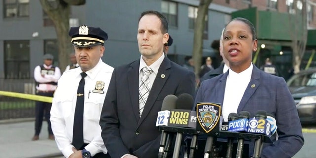 In this image taken from video provided by the NYPD, New York Police Commissioner Keechant Sewel, right, speaks during a news conference, Friday, April 8, 2022, in New York. A teenage girl has been killed and two other teens wounded in a shooting near a Bronx school. 