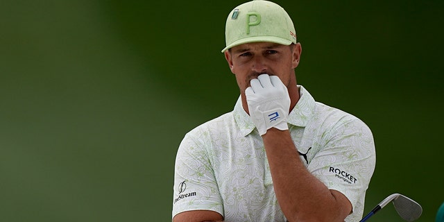 Bryson DeChambeau waits to take his shot during the Masters on April 8, 2022 in Augusta, Georgia.