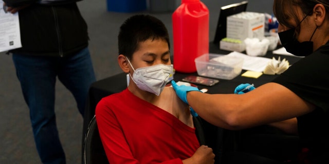 Young people will receive the COVID-19 vaccine on Tuesday, November 9, 2021 at the Children's Vaccine Clinic for children aged 5 to 11 at Willard Middle School in Santa Ana, California. 