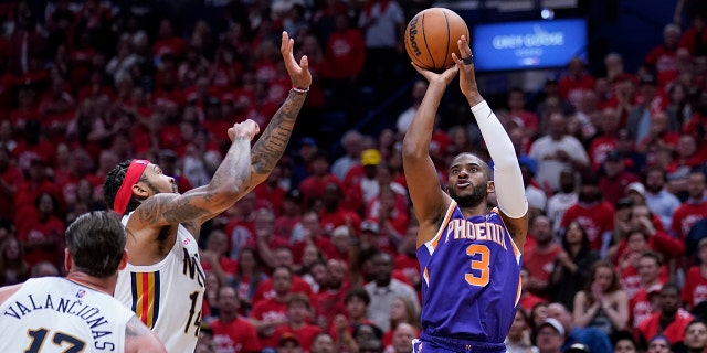 Phoenix Suns guard Chris Paul (3) shoots over New Orleans Pelicans striker Brandon Ingram in the second half of Game 6 of an NBA basketball playoff series in the first round, Thursday, April 28, 2022 in New Orleans. The Suns won 115-109, to win the series 4-2 and advance to the second round.