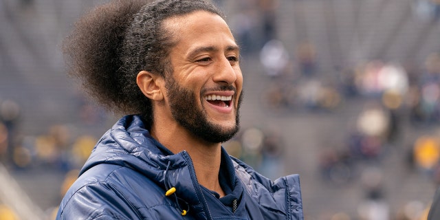 Colin Kaepernick interacts with fans before the Michigan spring football game at Michigan Stadium on April 2, 2022 in Ann Arbor, Michigan. Kaepernick was honorary captain for the game.