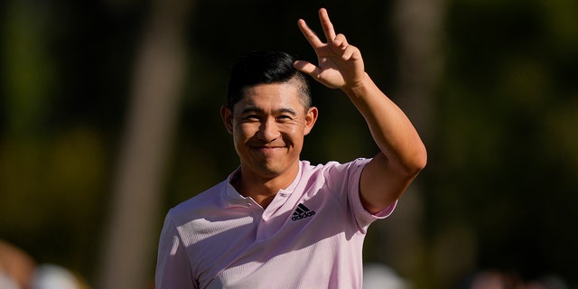 Colin Morikawa celebrates after being holed out on the 18th hole for a birdie during the final round at the Masters Golf Tournament on Sunday, April 10, 2022 in Augusta, Ga.