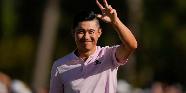 Collin Morikawa celebrates after holing out on the 18th hole for a birdie during the final round at the Masters golf tournament on Sunday, April 10, 2022, in Augusta, Ga.