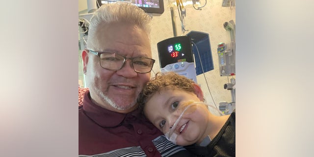 Sammy Jones, 4, of Huber Heights, Ohio, was born with hypoplastic left heart syndrome, which meant the left side of his heart didn’t work. He is pictured with his dad, Garland Jones.