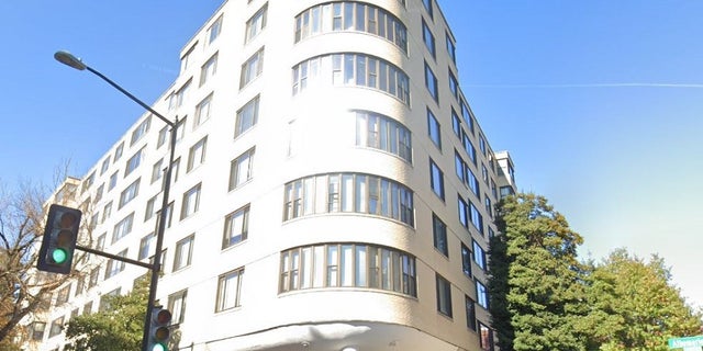 A woman who was bound on her legs fell out of a Washington D.C., apartment building Thursday and a suspect has been arrested, police said.
