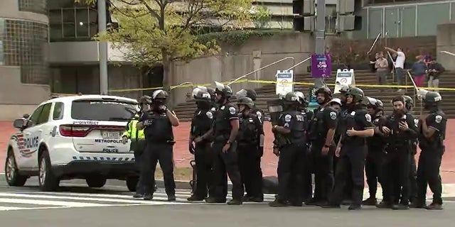 Police respond to an active shooter situation in Washington D.C., that inured at least four people Friday.