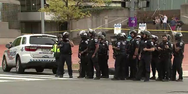 Police respond to an active shooter situation in Washington D.C., that inured at least four people Friday.
