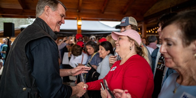 Former Sen. David Perdue on the campaign trail as he primary challenges GOP Gov. Brian Kemp of Georgia, on March 7 in Cumming, Georgia.