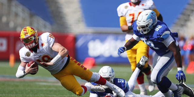 Davin Bellamy of the New Orleans Breakers tackles Bryan Scott of the Philadelphia Stars at Protective Stadium on April 17, 2022, in Birmingham, Alabama.