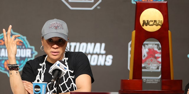 Head coach Dawn Staley of the South Carolina Gamecocks answers questions after a win over the Connecticut Huskies on April 3, 2022 in Minneapolis, Minnesota.