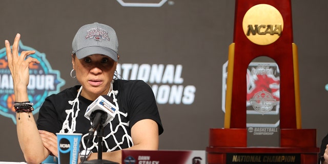 Head coach Dawn Staley of the South Carolina Gamecocks answers questions after a win over the Connecticut Huskies on April 3, 2022 in Minneapolis, Minnesota.