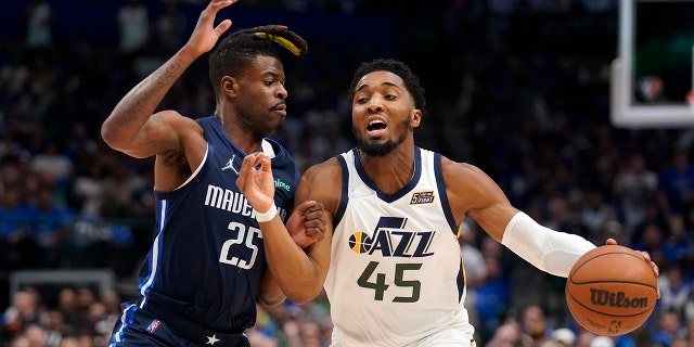 Donovan Mitchell, Jazz win opener as Mavericks play without Luka Doncic 2 Dallas Mavericks forward Reggie Bullock (25) defends as Utah Jazz guard Donovan Mitchell (45) works to the basket in the first half of Game 1 of an NBA basketball first-round playoff series, Saturday, April 16, 2022, in Dallas.