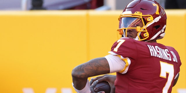 Washington quarterback Dwayne Haskins passes during warmups before the Carolina Panthers game at FedExField in Landover, Maryland, on Dec. 27, 2020.