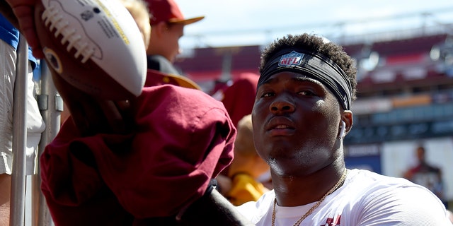 Dwayne Haskins #7 of the Washington Redskins signs autographs for fans prior to the game against the Dallas Cowboys at FedExField on Sept. 15, 2019 in Landover, Maryland.