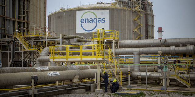 Operators work at the Enagas regasification plant, the largest LNG plant in Europe, in Barcelona, Spain, on March 29.