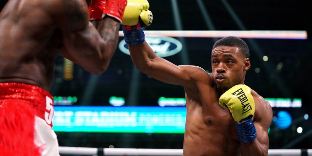 Errol Spence Jr adds 3rd title belt with TKO over WBA champ Yordenis Ugás 2 Errol Spence Jr. punches Yordenis Ugas, from Cuba, during a welterweight championship boxing match Saturday, April 16, 2022, in Arlington, Texas.