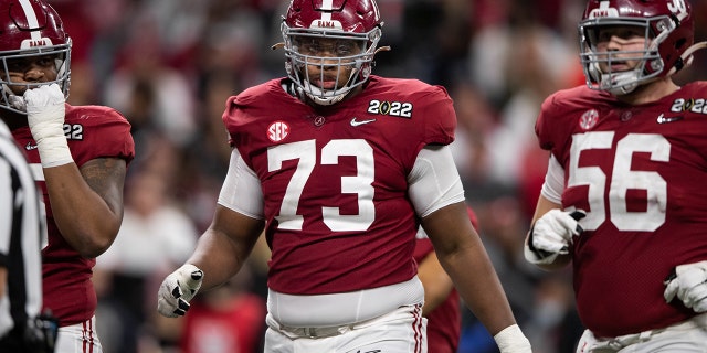 Alabama Crimson Tide OL Evan Neal (73) walks down the field during the Alabama Crimson Tide versus the Georgia Bulldogs in the College Football Playoff National Championship, on January 10, 2022, at Lucas Oil Stadium in Indianapolis, IN.